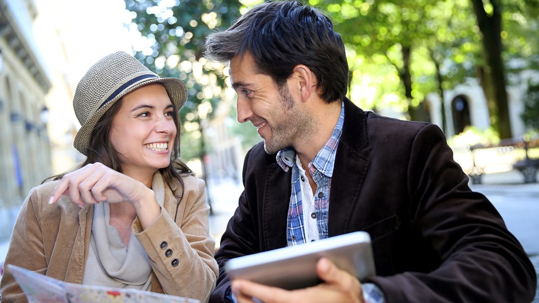 US taxes for expats – American couple abroad discussing tax requirements