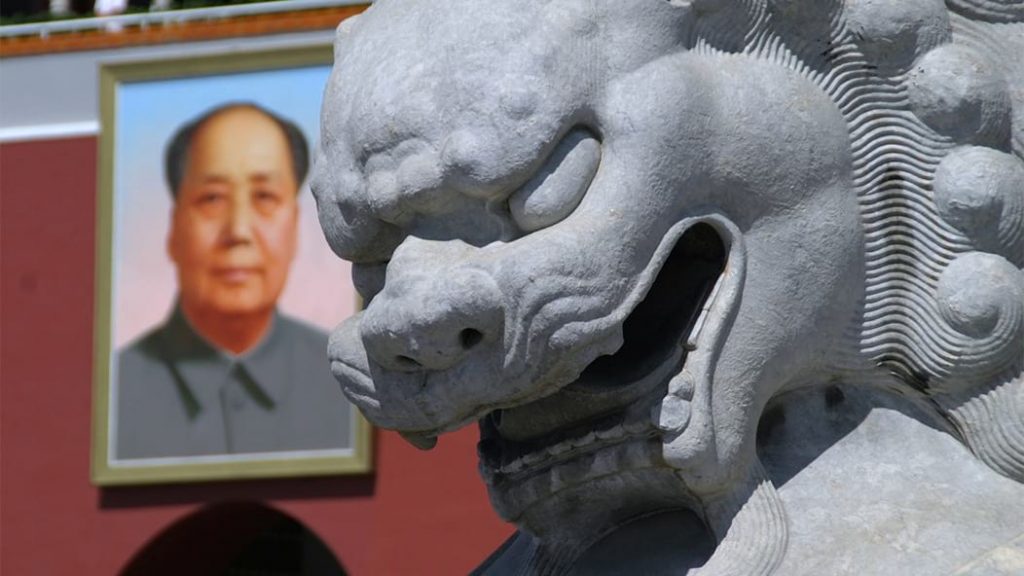 US expat taxes in China illustrated with Beijing lion statue and Mao portrait