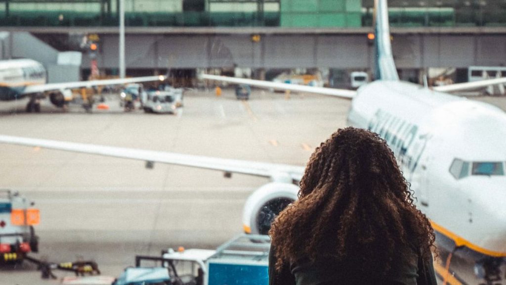 2020 FEIE and substantial presence test impact – traveler at airport during coronavirus pandemic