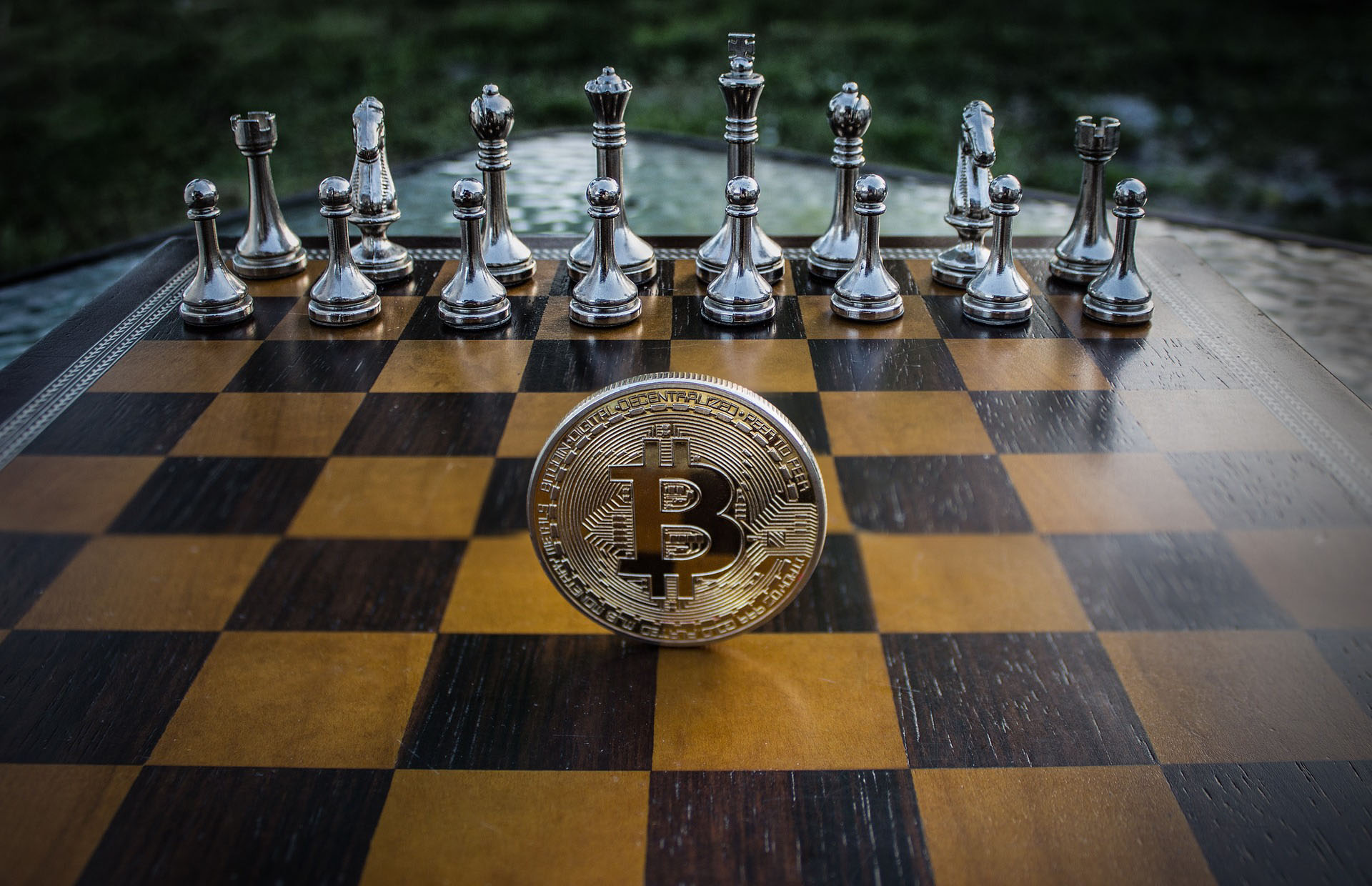 Bitcoin coin on a chessboard representing strategic cryptocurrency tax loss harvesting planning